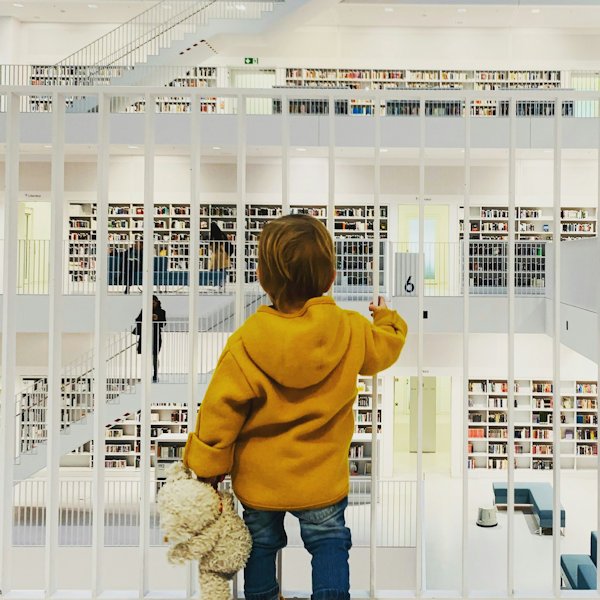boy looking at library by Ante Hamersmit
