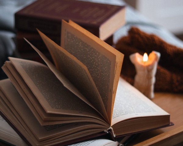 open book with candle by anotherxlife (detail)